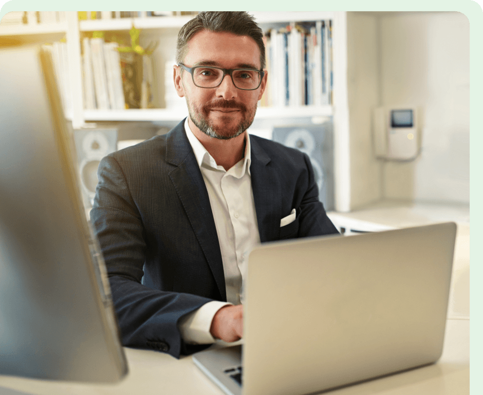GastroGenius partner in front of a laptop